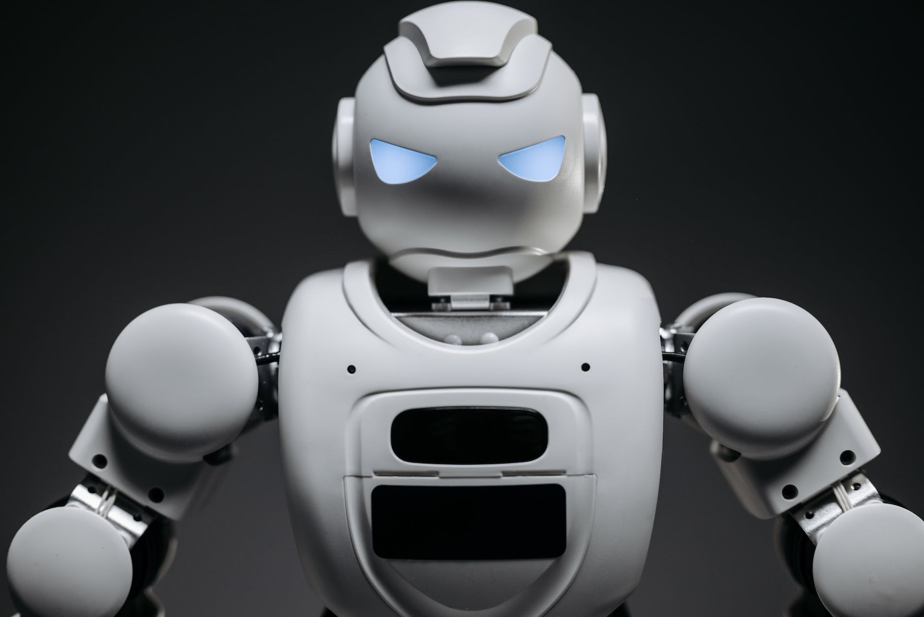 close up shot of white robot toy